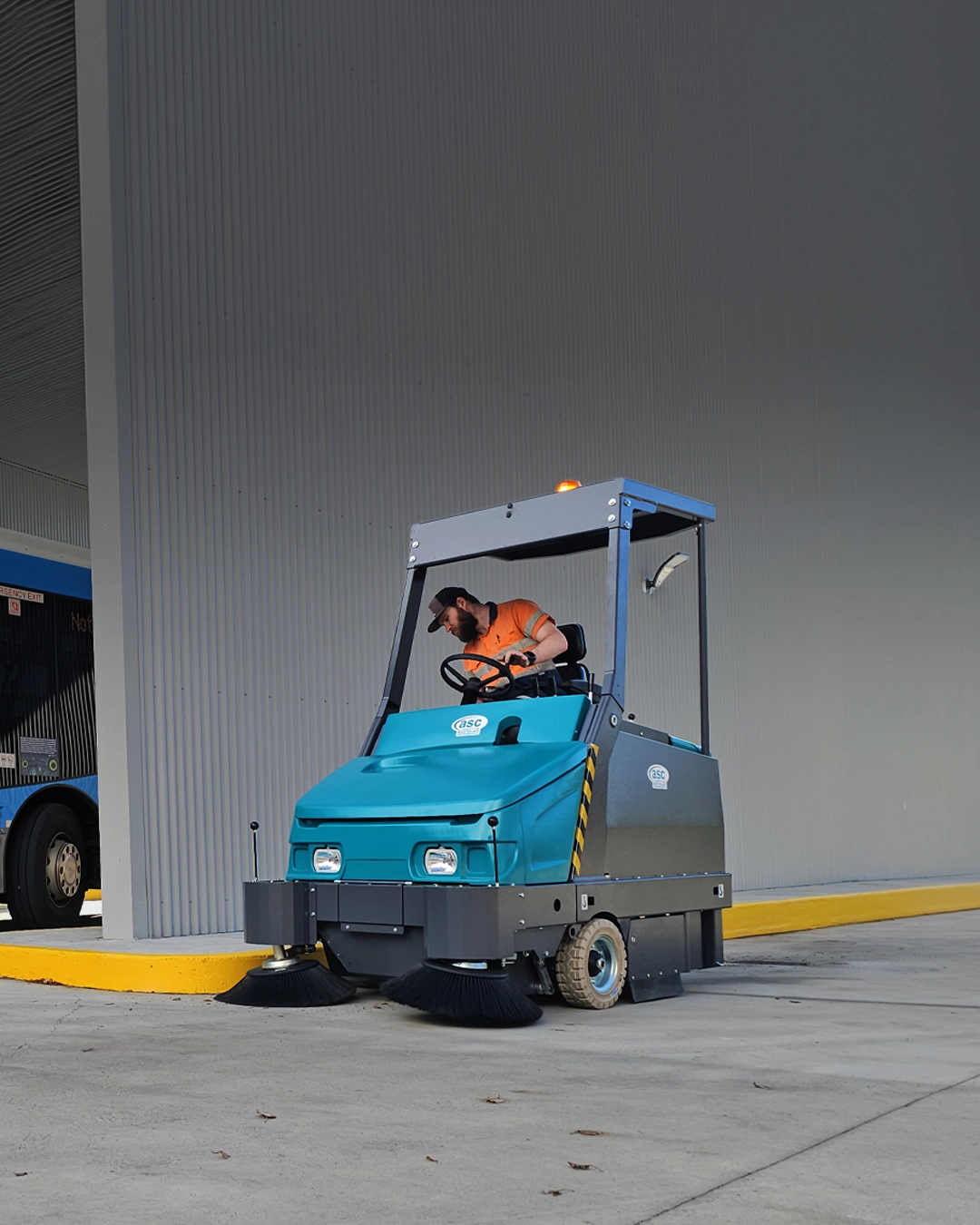 Industrial sweeper cleaning automotive workshop and vehicle service centre