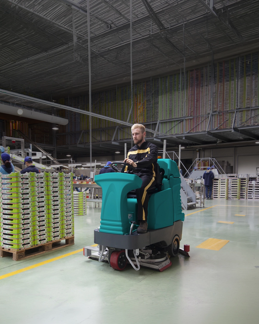 Ride-on floor scrubber cleaning educational facility and learning environment