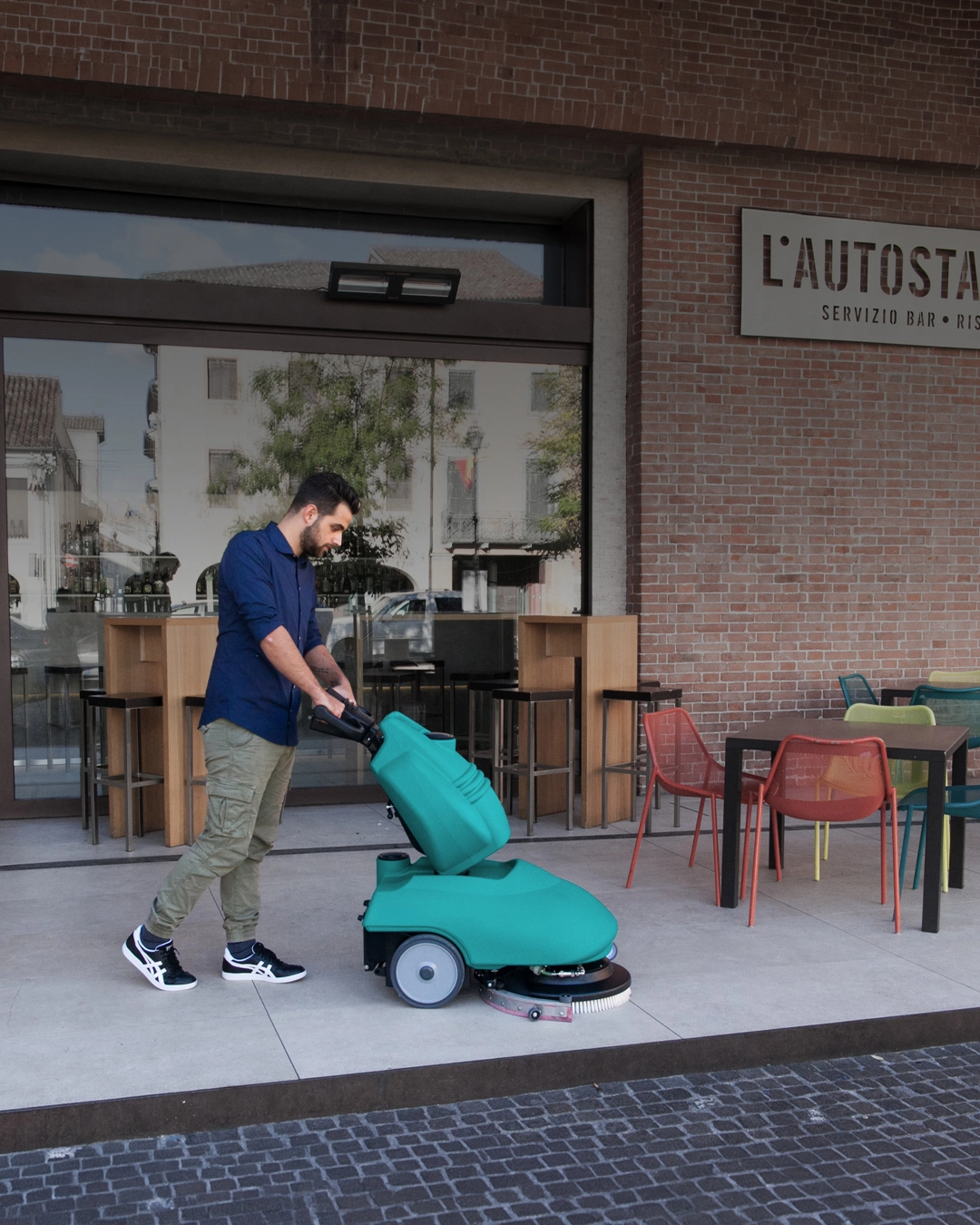 Commercial floor scrubber cleaning food and beverage facility entrance