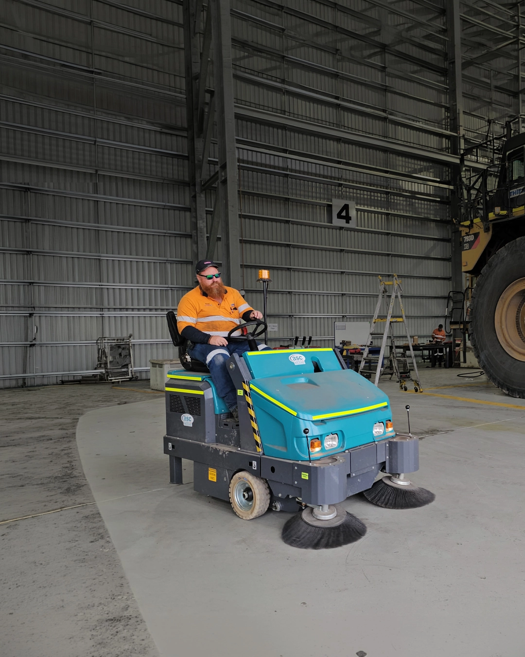 Ride-on sweeper cleaning transport and railway maintenance facility