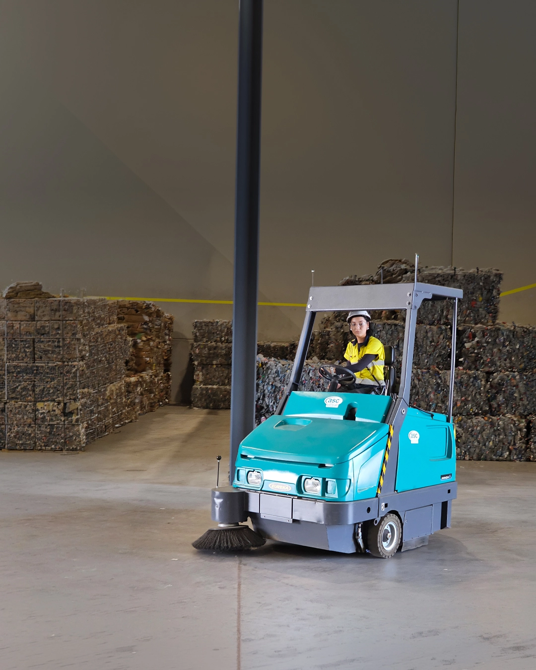 Ride-on floor cleaning machine maintaining residential and community facility floors